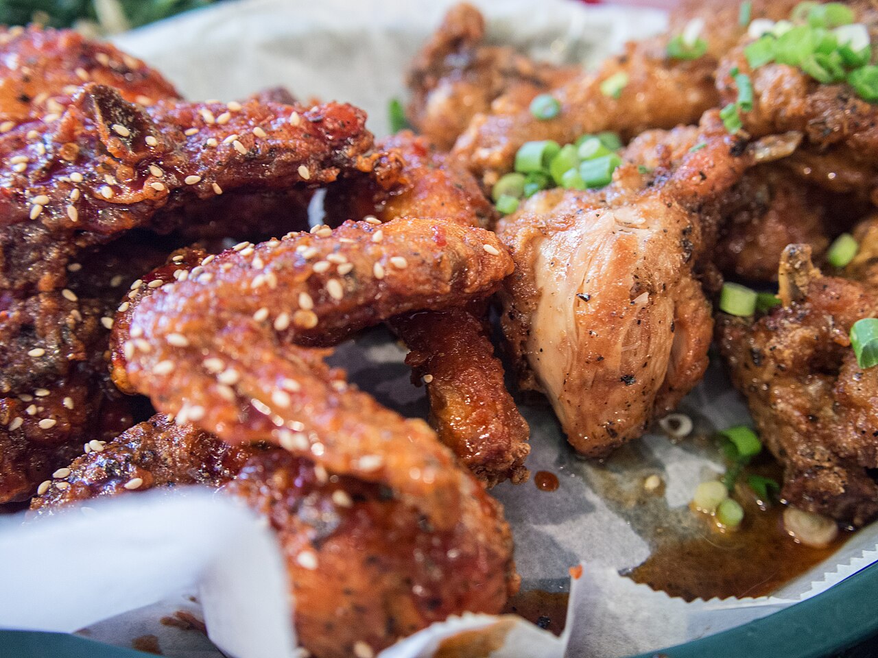 Banban fried chicken: pieces coated in red sauce next to plain fried pieces