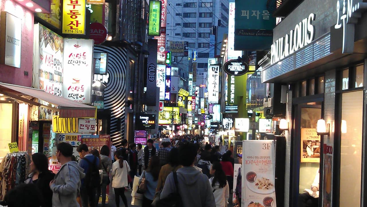 Myeong-dong shopping street at night, crowded under shop signs